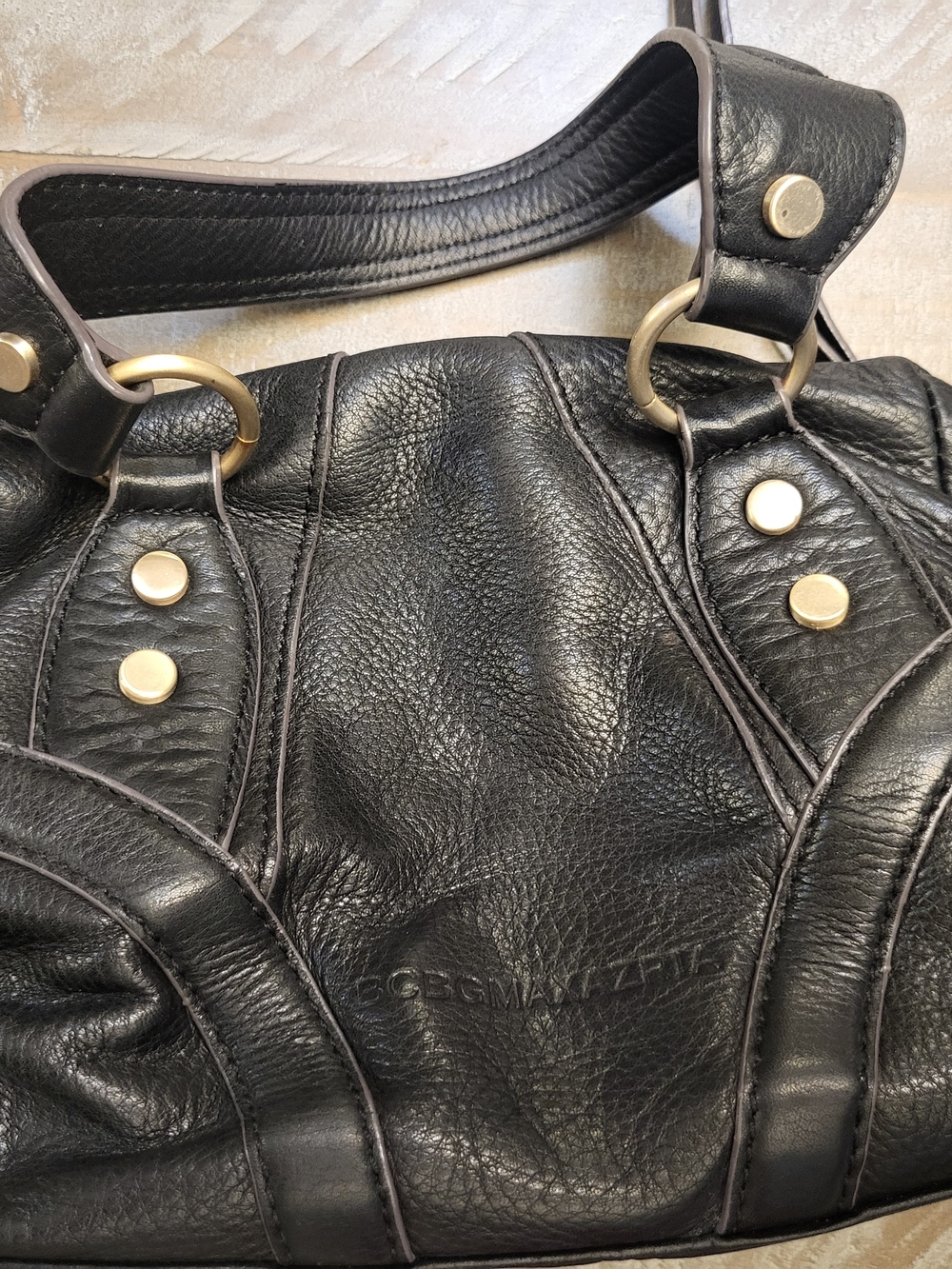 BCBGMaxAzria Black Leather hand purse with Goldish/brass Hardware